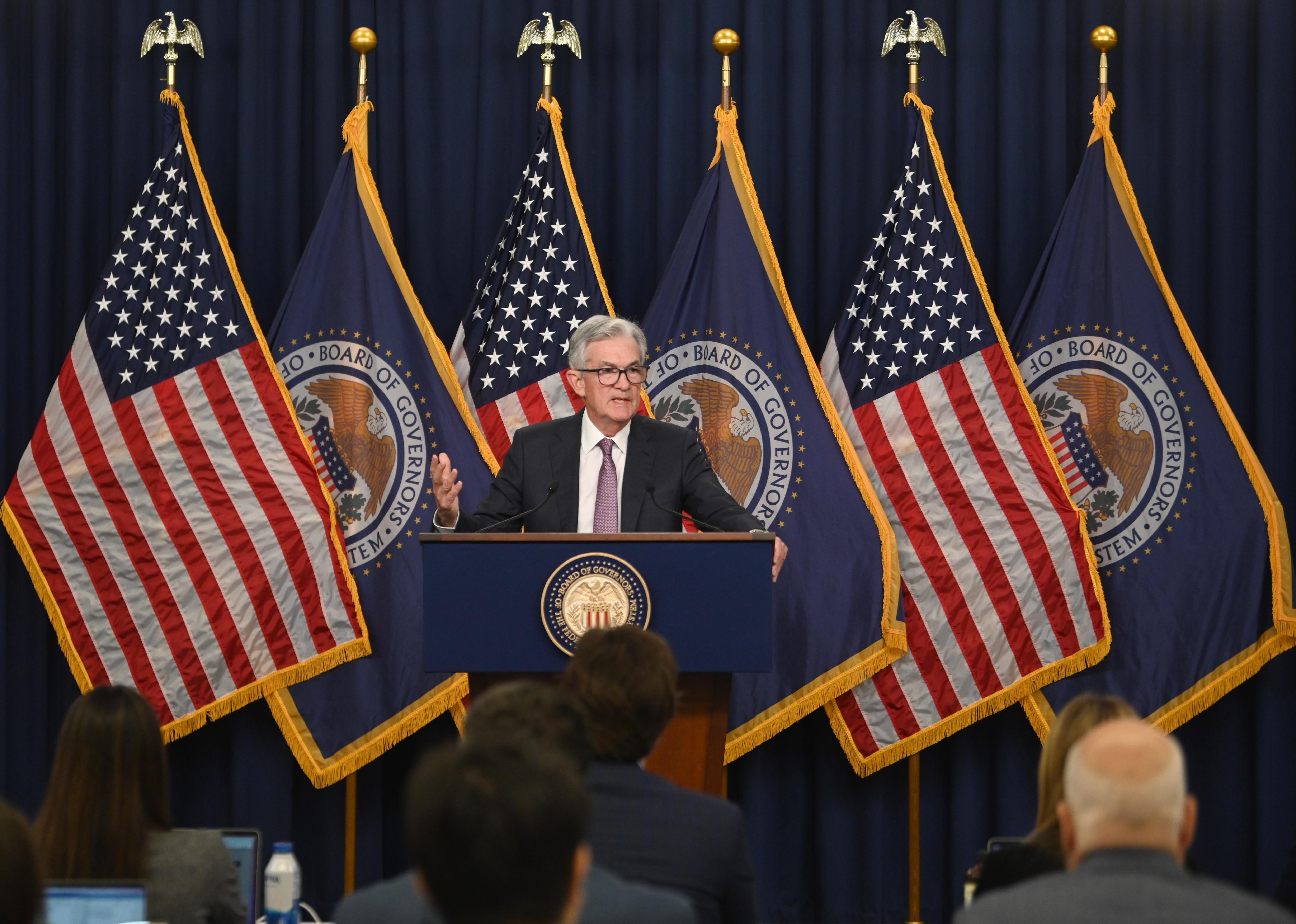 Federal Reserve Chair Jerome Powell attends a news conference.