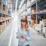 A woman working in a furniture warehouse.