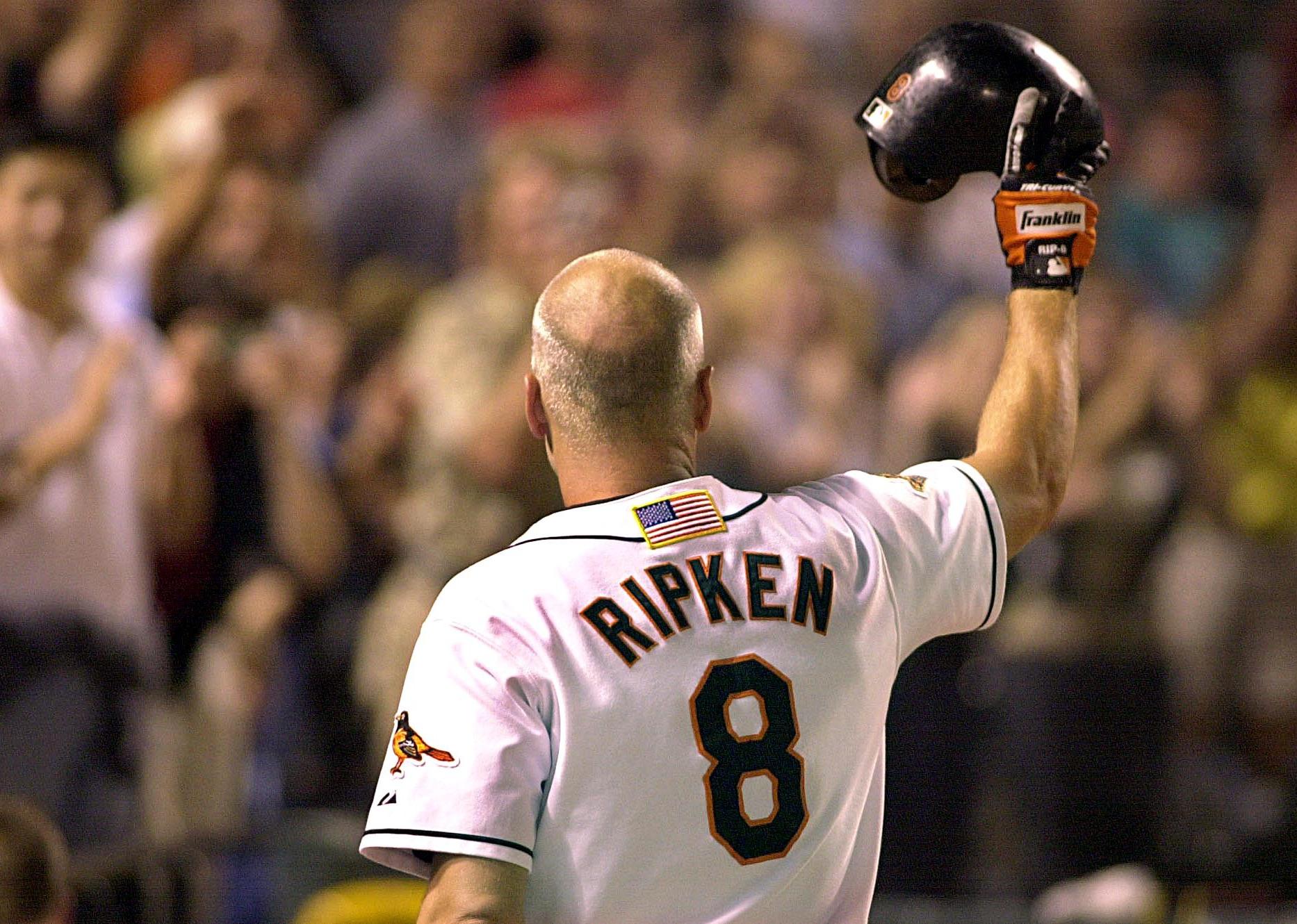 Cal Ripken, Jr., tips his helmet to the crowd