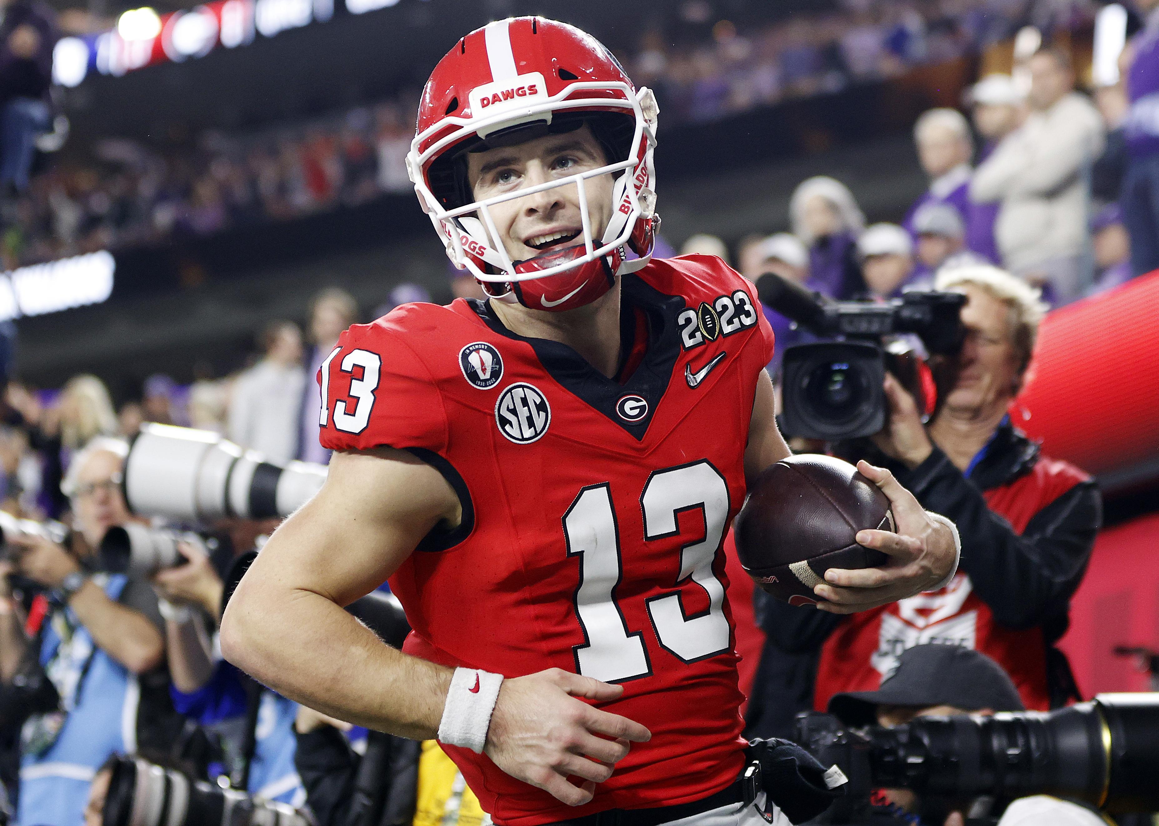 Stetson Bennett of the Georgia Bulldogs reacts after a rushing touchdown.