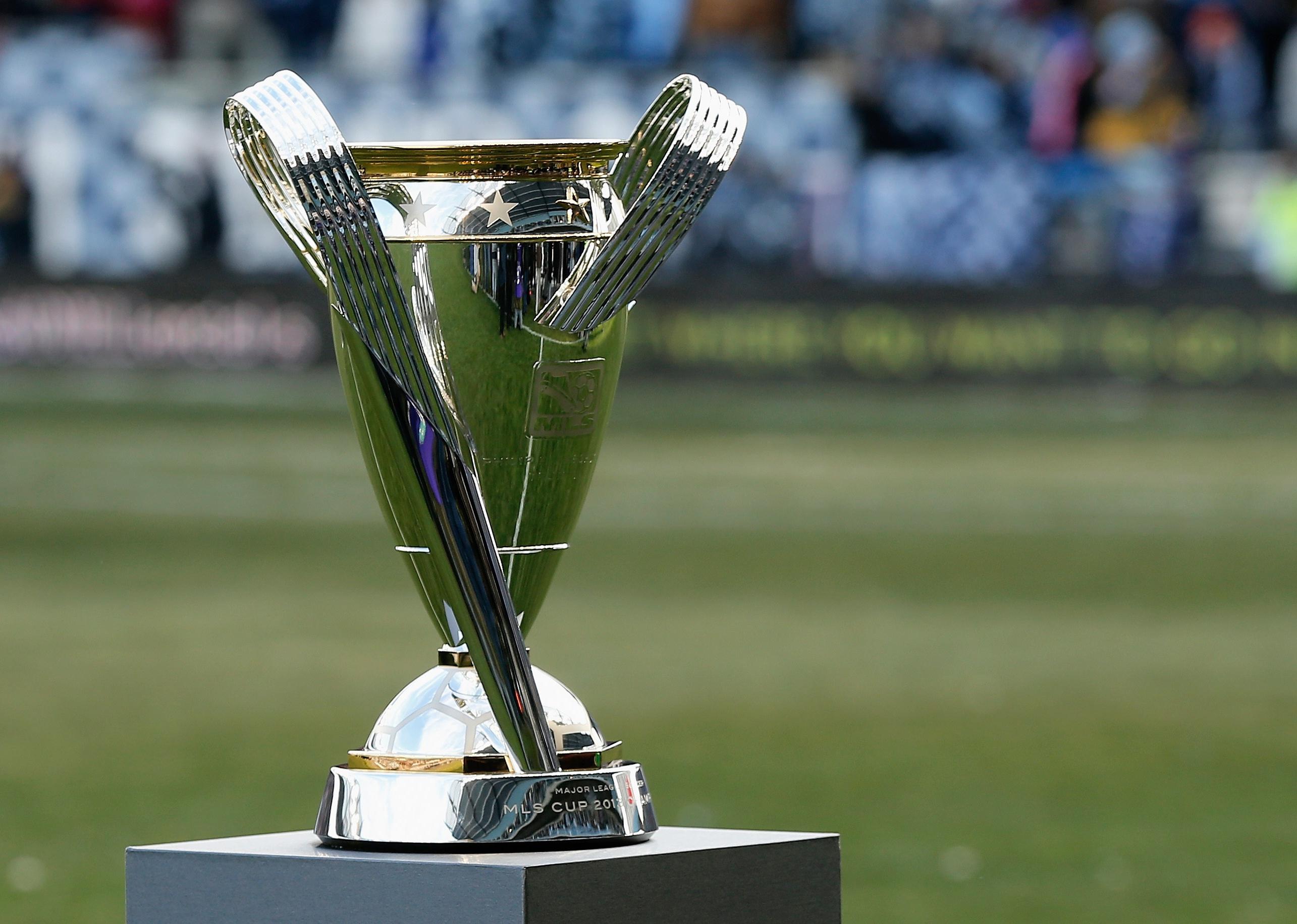 The Philip F. Anschutz trophy is seen on the field.