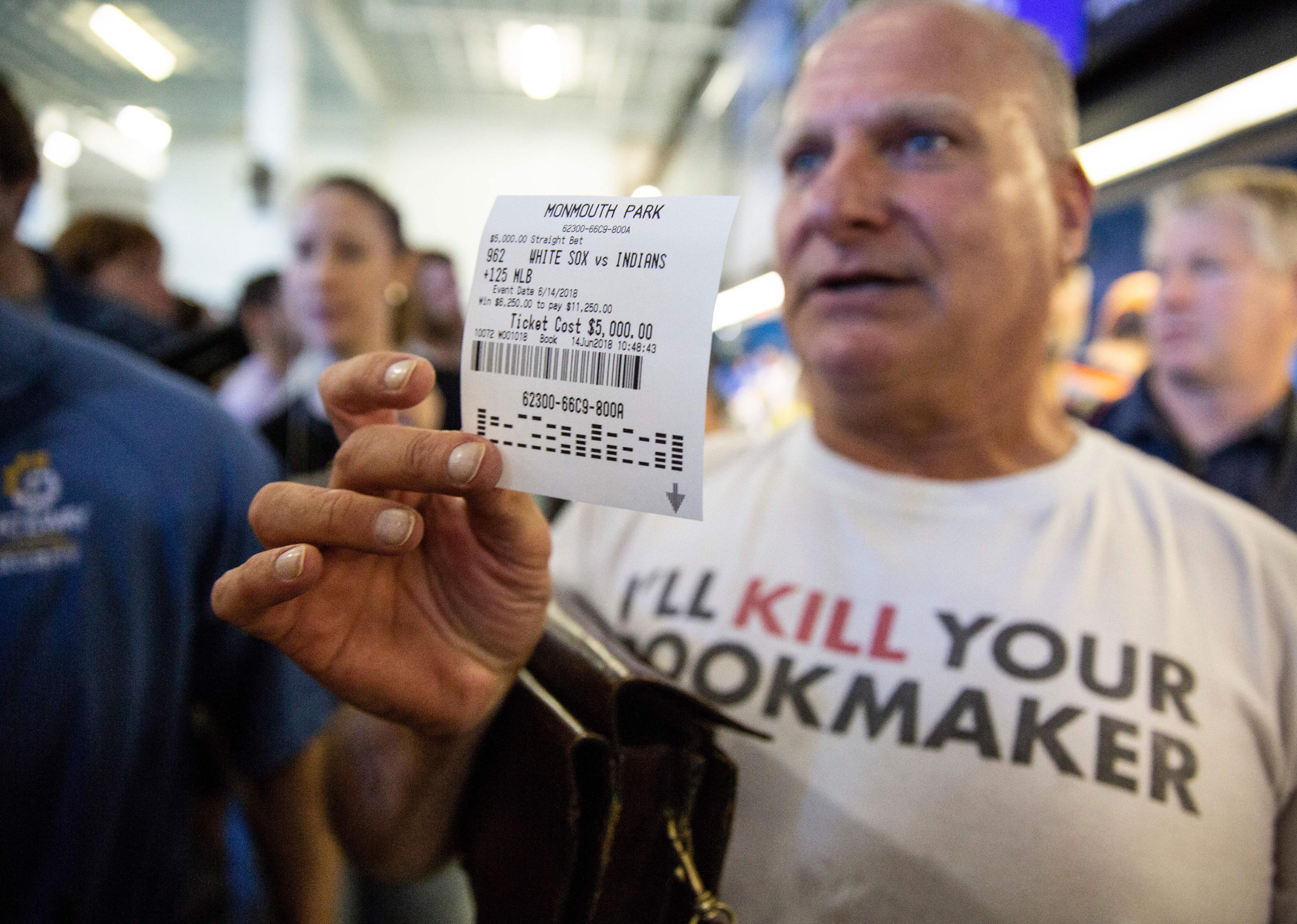 Professional sports-better up a betting slip for $5000 USD.