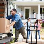 Family unloading a moving truck.