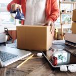 Business owner taping a package