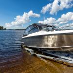 Boat launch on lake water from trailer.