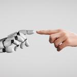 Human and robot fingers touching. 