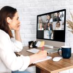A female on a video call with coworkers