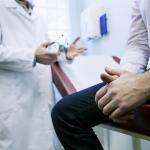 Man in consultation with a doctor.