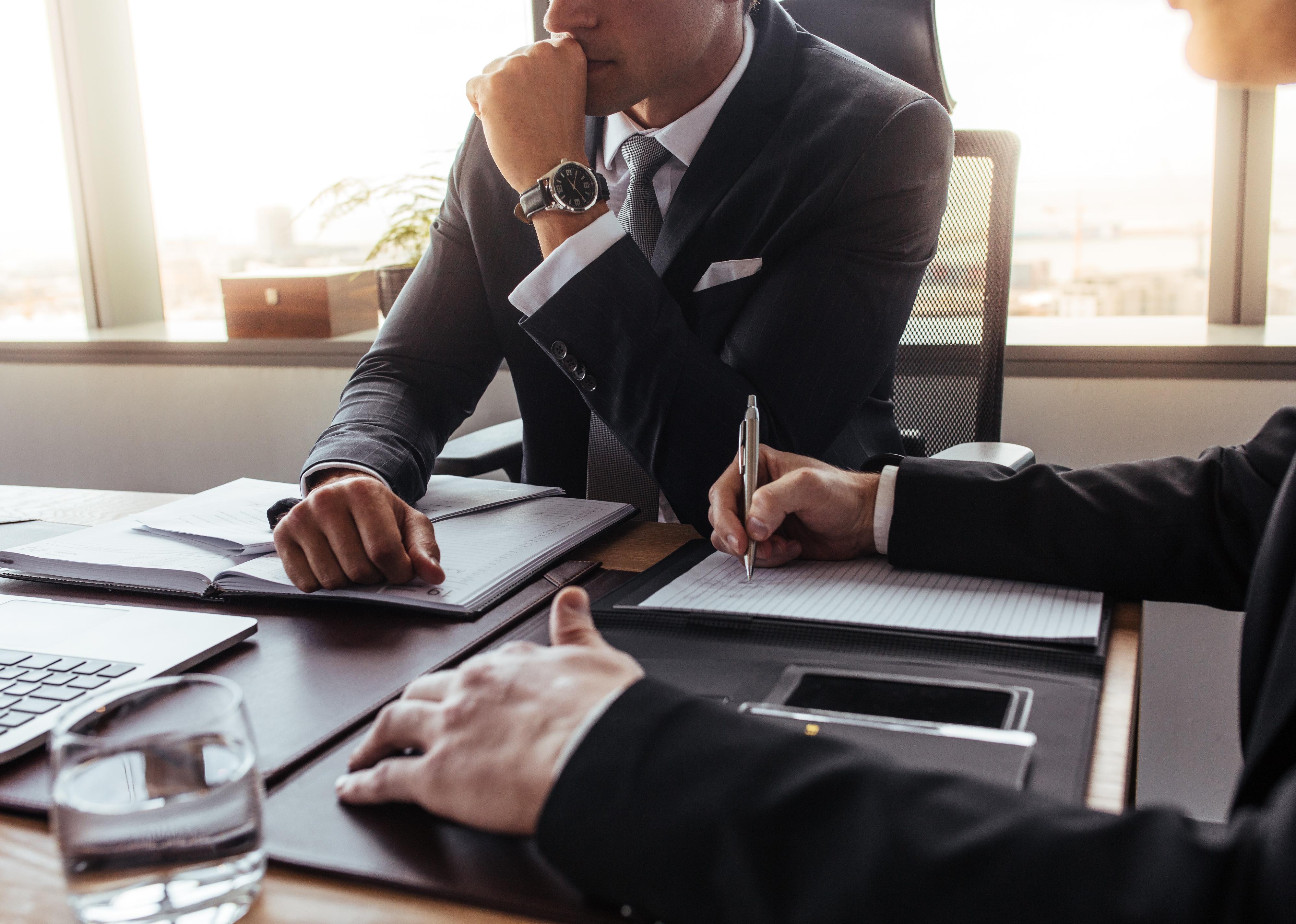 Cropped shot of two business partners working together in office.