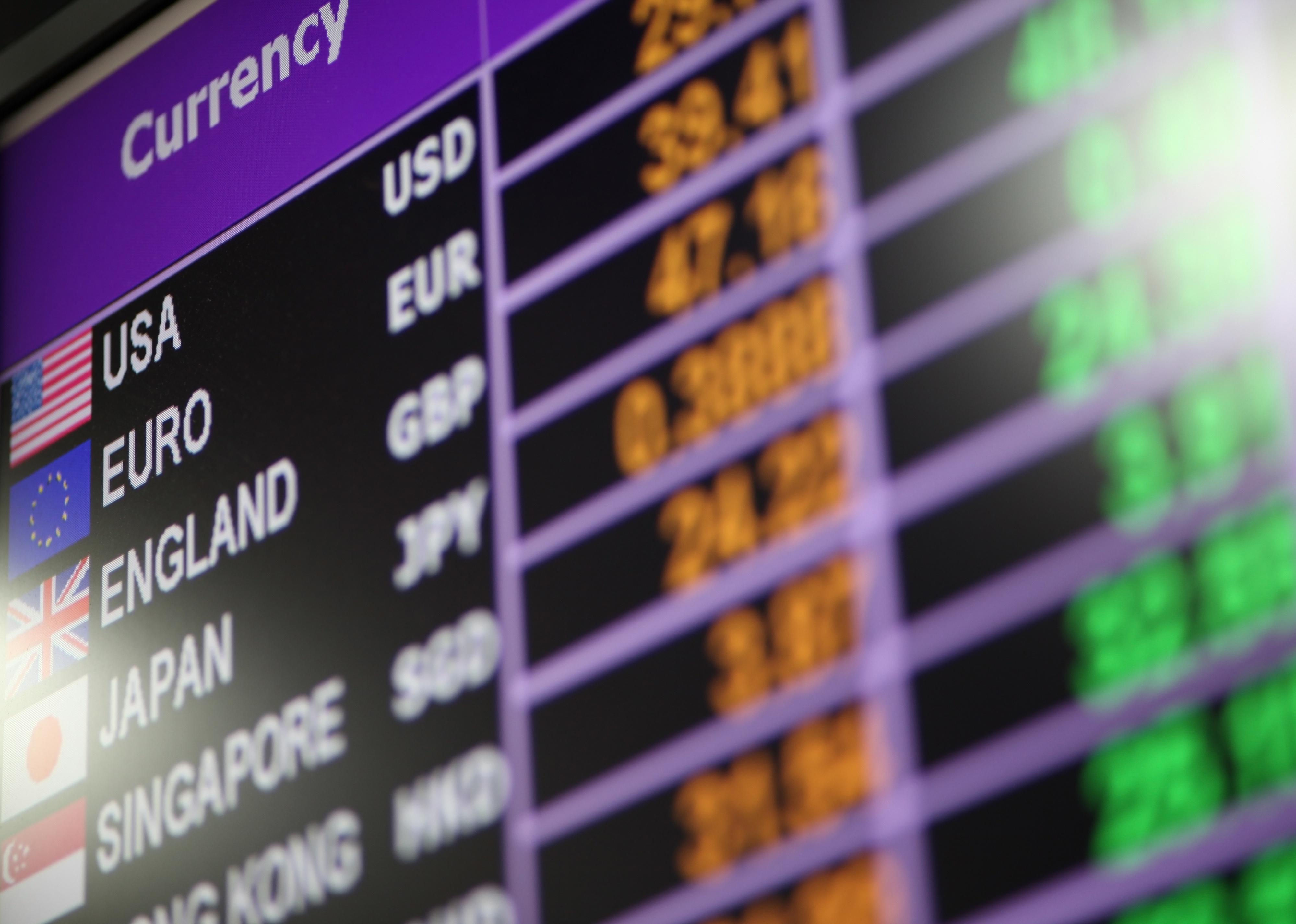 Currency exchange rate board on digital display.