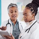 Two medical professionals in white coats.