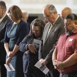 Cochise County Supervisor Peggy Judd, center, bows her head in prayer during the inauguration of the Southern Arizona Regional Border Operations Center in Sierra Vista, Arizona.