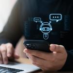 Businessman using smartphone to connect to an AI chatbot.