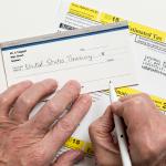 Taxpayer writing a check to the U.S. treasury.