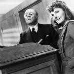 Black and white image of Spring Byington, unidentified man, and Jean Arthur in a scene from the film 'The Devil And Miss Jones', 1941. 