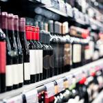 Bottles of wine on a shelf in a liquor store.