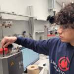 Indianapolis student Danny Bonila works as a lab technician at Plastic Recycling Inc. 