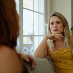 A woman talking to her friend at home.
