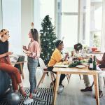 Coworkers having a Christmas party in their office.