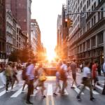 A busy crosswalk in a metro area.