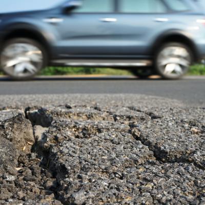 Close up on damaged road surface.