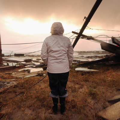 A resident stands among damage from Hurricane Sandy in Atlantic City, New Jersey.