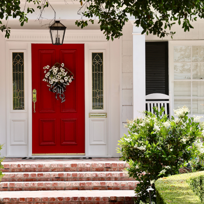 House with red door and American flag.