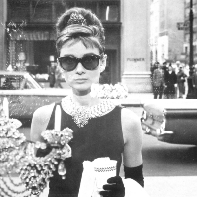 Audrey Hepburn looks into a window a Tiffany’s in a still from the film ‘Breakfast at Tiffany’s.’