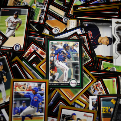 An array of baseball cards spread out on a table