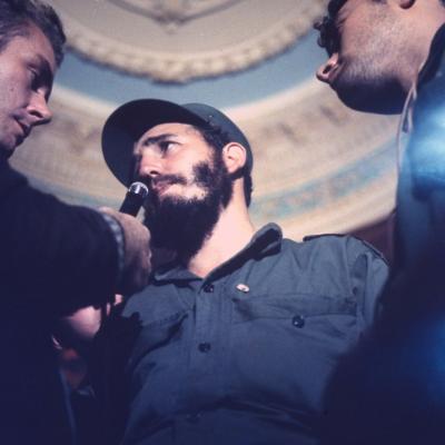 Press interviewing victorious Fidel Castro en route to rebel victory celebration in Havana, Cuba, in 1959.