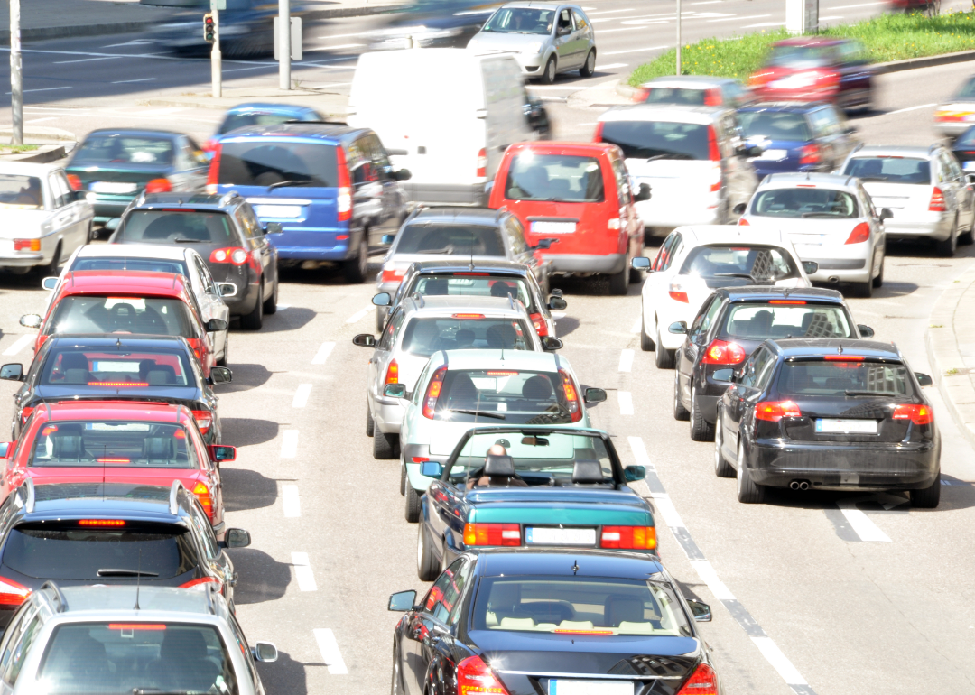 Several lanes of cars backed up on a highway.