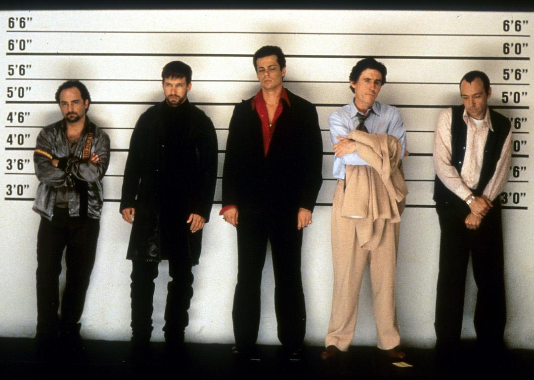 Actors Kevin Pollak, Stephen Baldwin, Benicio Del Toro, Gabriel Byrne, and Kevin Spacey line up in a scene from the 1995 whodunit film 'The Usual Suspects.'