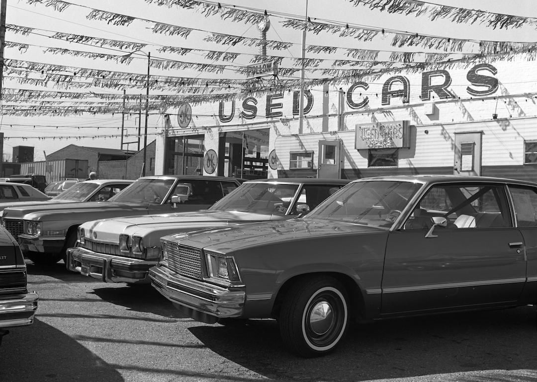 Used cars for sale in an OK lot in the 1970s.