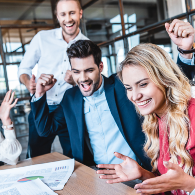 A group of office workers celebrating a success