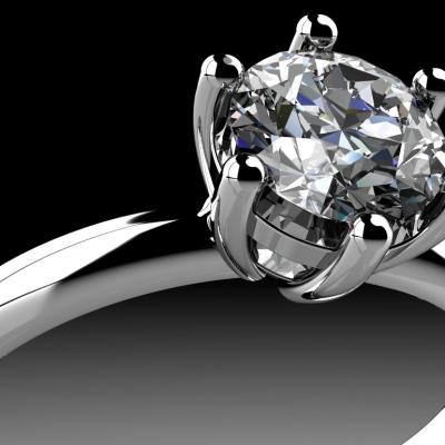 A diamond in the setting of a ring.
