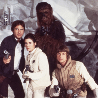 Actor Harrison Ford ,Carrie Fisher, Harrison Ford, Mark Hamill and Peter Mayhew as Chewbacca pose for a portrait on the set of Star Wars: The Empire Strikes Back in 1979 in London, England.