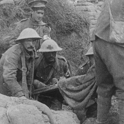 An archival photo of soldiers in trenches during World War 1 in a scene from "They Shall Not Grow Old"
