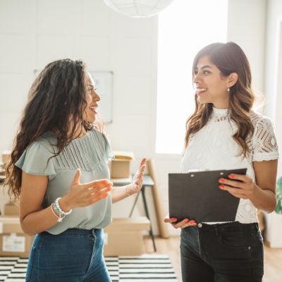 Two women small business owners talking