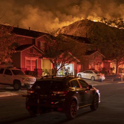 Flames come close to houses during the Blue Ridge Fire on October 27, 2020 in Chino Hills, California.
