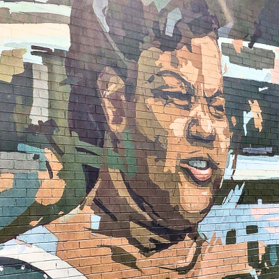 Sarah Mae Flemming mural on the side of a building in Columbia, South Carolina.