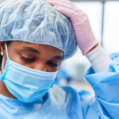 Closeup of an exhausted operating room nurse.