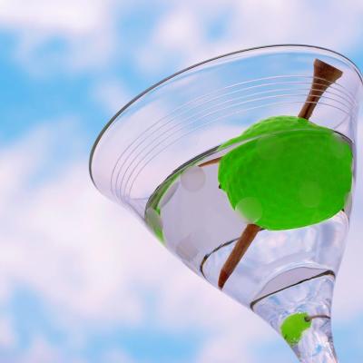 martini with golf tee and ball instead of olive 