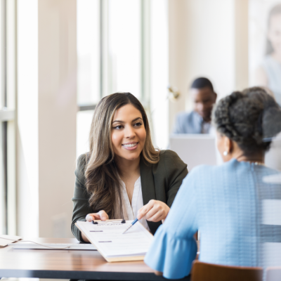 loan officer going over paperwork with client