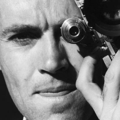 Henry Fonda poses with his camera