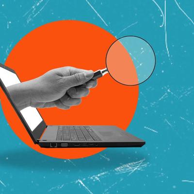 concept of background check illustrated with hand holding magnifying glass coming out of computer screen