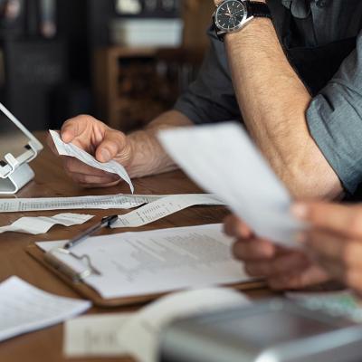 business owners going through receipts and finances