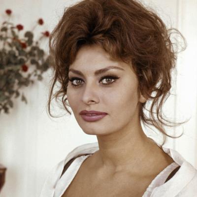 Actor Sophia Loren poses for a portrait in a white dress circa 1960. 