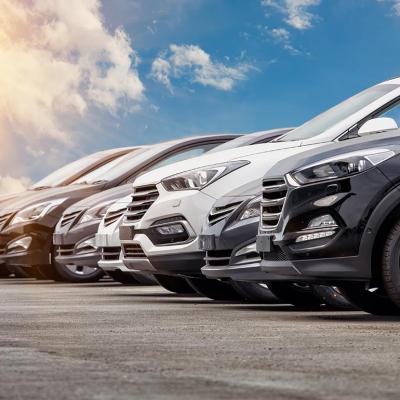 Row of cars for sale in a lot