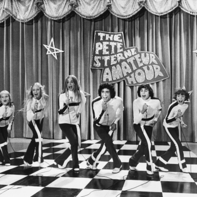 A singing scene from the American TV series, The Brady Bunch, here featuring Susan Olsen, Eve Plumb, Maureen McCormick, Barry Williams, Christopher Knight, and Mike Lookinland.