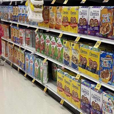 Cereal boxes displayed on a grocery store shelf.